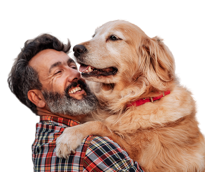 middle aged white man holding a very large happy golden retriever